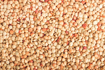 Lentil grains scattered as a background