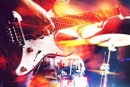 Stage lights.Abstract musical background.Playing guitar and concert concept.Live music background.Music festival.Instrument on stage and band