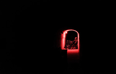 A man in a protective suit in a bunker carries a wheelchair. Bunker radiation protection.
