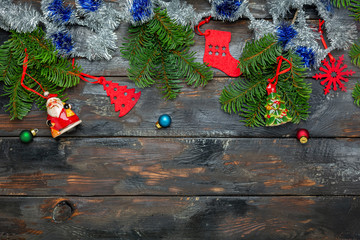 Festive Christmas composition with tinsel and fir branches.