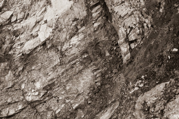 Sepia effect on rocky beds of a mountain. Textured surfaces concept