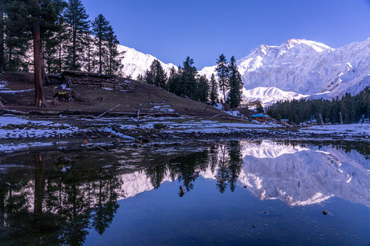 Water Reflection of Fairy meadows during the sunset period with  Nanga parbat mountain range , gilgit-baltistan , Pakistan