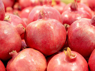 Fresh juicy pomegranate in the market. Superfood for a healthy diet full of beneficial elements and antioxidant