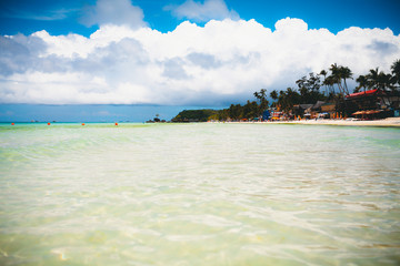 Vacation summer holidays background wallpaper - sunny tropical exotic Caribbean paradise beach with white sand in Seychelles Praslin island Thailand style with palms and rocks