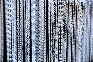 background of silver chain jewelry on black background close-up