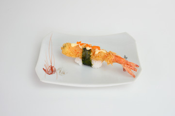 Deep fried shrimp tempura sushi nigiri with breadcrumbs and seaweed