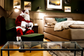 Saint Nicholas is sitting in an armchair. Interior of a luxury home. Table corner with empty space...