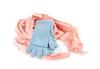 Stylish gloves and scarf on white background. Autumn clothes