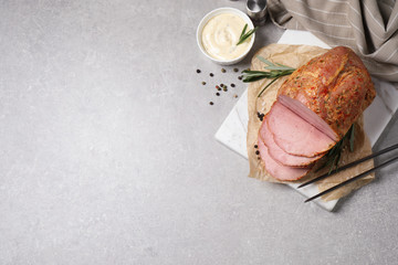 Delicious ham served on grey table, flat lay. Space for text