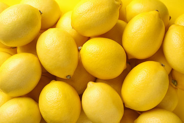 Ripe lemon fruits as background, top view