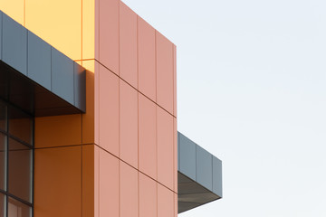 Geometric color elements of the building facade with planes, lines, corners with highlights and...
