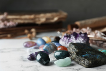 Obraz na płótnie Canvas Pile of different beautiful gemstones on marble table