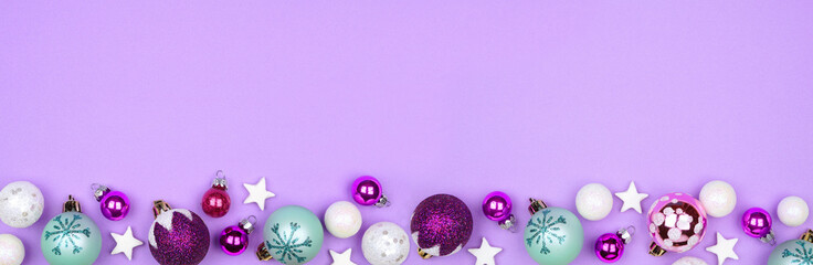 Modern pastel Christmas ornament border banner over a light purple background with copy space