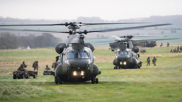 Chinook helicopters are loaded during a military exercise on Salisbury Plain