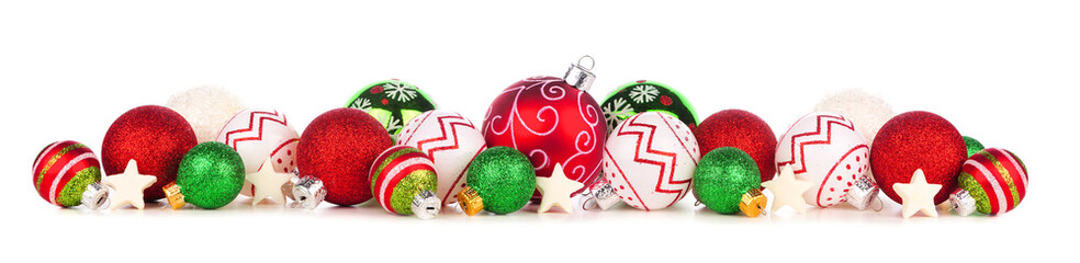 Christmas border of red, green and white ornaments. Side view isolated on a white background.