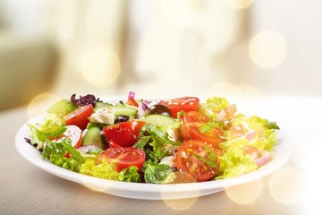Fresh greek salad on wooden table