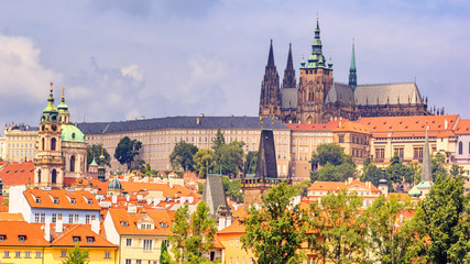 City summer landscape - view of the Hradcany historical district of Prague and castle complex...