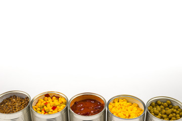 Canned food on white background. Green pea, beans, corn, lentils.