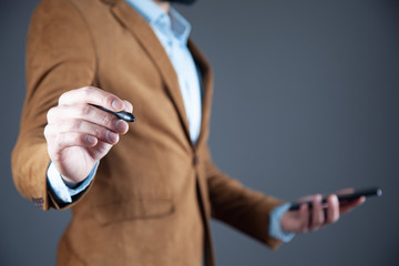 man hand phone with pen in screen