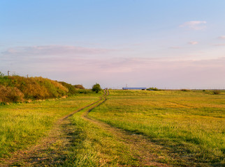 Path in the field at sunset