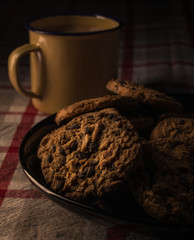 Cookies on a plate and a cup of coffee.