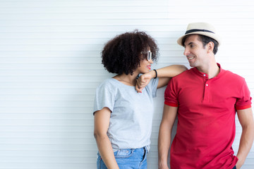 Lovely couple in summer casual clothes, studio shot