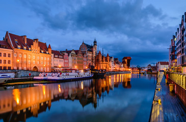 Sightseeing of Poland. Cityscape of Gdansk old town with beautiful reflection in the water, night view
