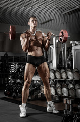 Obraz na płótnie Canvas guy bodybuilder with barbell