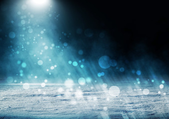 Winter abstract, blurred background with bokeh. Blurry night city lights in reflection on a snowy...