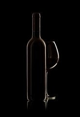 bottle and wine glass with red wine