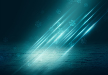 Winter abstract, blurred background with bokeh. Blurry night city lights in reflection on a snowy road. Neon light, falling snow, snowflakes.