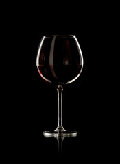 bottle and wine glass with red wine