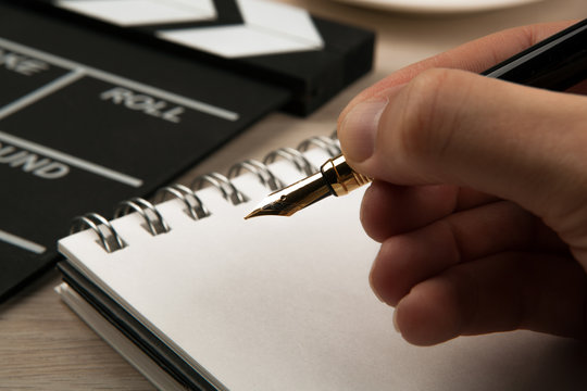 fountain pen in the hands of a screenwriter