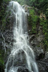 Landscape with water fall from high cliff of the mountain