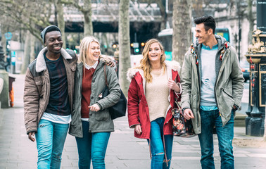 Multiracial group of millenial friends walking at London city center - Next generation friendship...