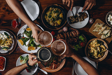 delicious European and Slavic cuisine on the big table. Group of people eating at table. table with food, top view