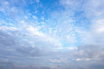 Dark and white clouds on blue sky