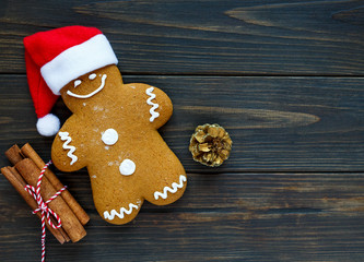Homemade gingerbreads on plate on wooden background. Holidays and celebration concept, greeting card mockup, festive decoration. Christmas and New Year composition.