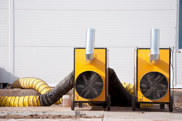 Large diesel heaters at a construction site. Equipment for heating a room in a cold period of time.