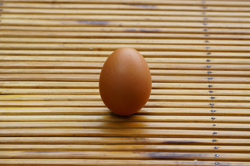 Eggs in basket with wood table background