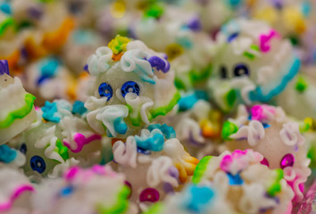 Fototapeta na wymiar Sugar and glass sequins skulls, typical sweets during the time of the day of the dead in Mexico