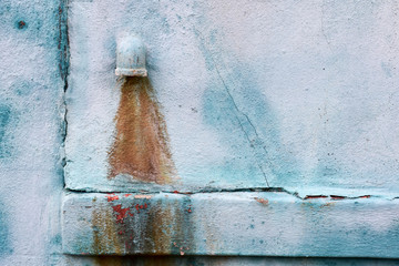 Abstract surreal image shows rusty water pouring from a tap. Safe drinking water is a basic human...