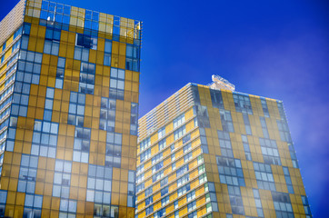 Colourful yellow and ble buildings against clear sky