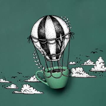 Flying cup of coffee in a hot air baloon