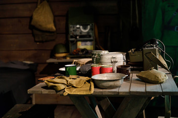 Interior of dugout Soviet soldiers during second world war, items of military life, reconstruction