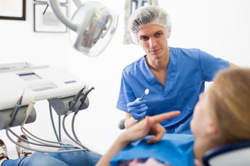 Young woman on dental checkup in modern dentist office