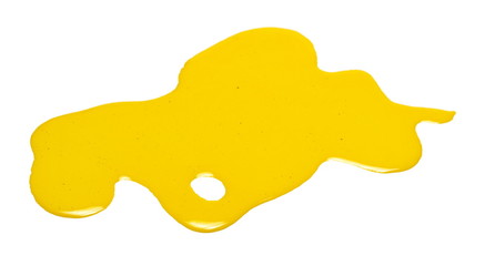 Spilled yellow oil paint isolated on white background