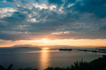 Sunset over the sea with some ship
