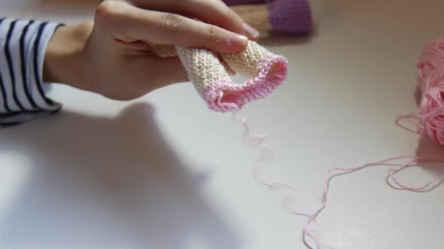 Woman's hands while Doll making