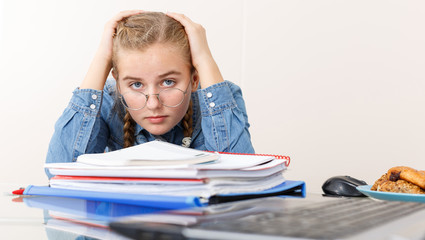 Girl tired of doing her homework